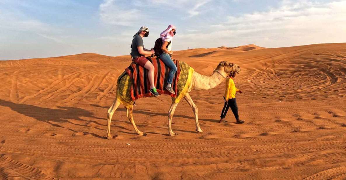 Dubai: Red Dunes ATV, Sandsurf, Camels, Stargazing & BBQ at Al Khayma ...